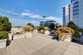 Apartment building roof top terrace exterior with lounge chairs Royalty Free Stock Photo