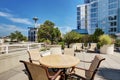 Apartment building roof top terrace exterior with lounge chairs Royalty Free Stock Photo