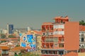 Apartment buildings in pastel colors and with street art in Lisbon