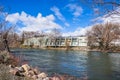 Apartment complex on the shoreline of Truckee River, Reno, Nevada; increased water level due to snow melt Royalty Free Stock Photo