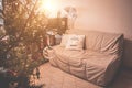 Apartment decorated with Christmas pillows. Cozy festive background. Toned