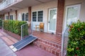 Apartment with handicapped wheelchair ramp by the door