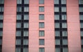 Apartment hotel building pink brick modern windows residential skyscraper Royalty Free Stock Photo