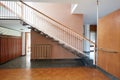 Apartment interior with black marble staircase and wooden floor