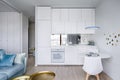Apartment interior with white kitchenette