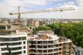 Apartment or office tall building under construction. Brick walls, glass windows, scaffolding and concrete support pillars. Tower Royalty Free Stock Photo