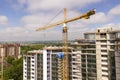 Apartment or office tall building under construction. Brick walls, glass windows, scaffolding and concrete support pillars. Tower Royalty Free Stock Photo