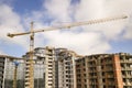 Apartment or office tall building under construction. Brick walls, glass windows, scaffolding and concrete support pillars. Tower Royalty Free Stock Photo