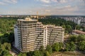 Apartment or office tall building under construction. Brick walls, glass windows, scaffolding and concrete support pillars. Tower Royalty Free Stock Photo