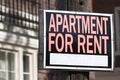 Apartment for rent sign in an urban setting Royalty Free Stock Photo