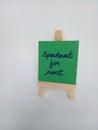 Apartment for rent sign on a wood easel on a white background Royalty Free Stock Photo