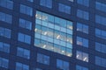 Apartment windows at night with lights Royalty Free Stock Photo