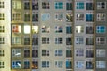 Apartment windows at night in new condo highrise building full o Royalty Free Stock Photo