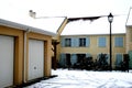 Apartments and garages in snow