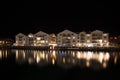 Apartments reflected in the water at night