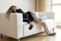 Apathic lazy woman lying in sofa