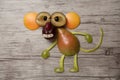 Ape made with fruits on wooden background