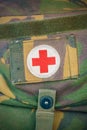 Red cross medical aid symbol on a vintage jute army bag