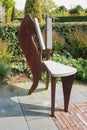 Original rusty chair for decoration of the garden.