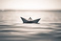Aper boat on sea waves. toned image of paper boat.