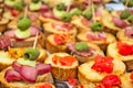 Aperitif buffet with appetizers and bruschetta with tomatoes, olives, sauces and salami Royalty Free Stock Photo
