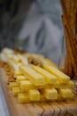 Aperitif of cheese cut into sticks and bread sticks Royalty Free Stock Photo