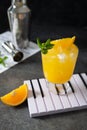 Aperitif with vodka, orange juice and mint. Selective focus. Classic Screwdriver cocktail drink. Summer refreshment. Orange aperol