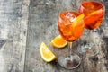 Aperol spritz cocktail in glass on wood