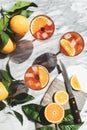 Aperol Spritz cocktail in glasses with oranges, top view