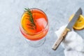 Aperol Spritz Cocktail with Orange Slice, Rosemary and Ice.