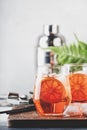 Aperol spritz cocktail in wine glass with sparkling wine, liqueur, ice cubes and red orange - summer Italian low alcohol cold Royalty Free Stock Photo