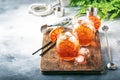 Aperol spritz cocktail in wine glass with sparkling wine, liqueur, ice cubes and red orange - summer Italian low alcohol cold Royalty Free Stock Photo