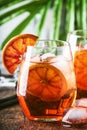 Aperol spritz cocktail in wine glass with sparkling wine, liqueur, ice cubes and red orange - summer Italian low alcohol cold Royalty Free Stock Photo