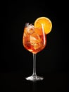 Aperol spritz garnished with an orange slice isolated on black Royalty Free Stock Photo