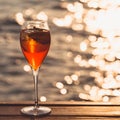 Aperol spritz at a wooden pier at sunset. Luxury resort vacation Royalty Free Stock Photo