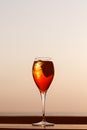 Aperol spritz at a wooden pier at sunset. Luxury resort vacation Royalty Free Stock Photo