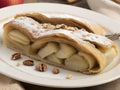 Apfelstrudel. Apple strudel, a dessert composed of thin layers of dough filled with apples, walnuts and cinnamon Royalty Free Stock Photo