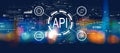 API - application programming interface concept with blurred city at night Royalty Free Stock Photo