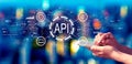 API - application programming interface concept with person using a smartphone at night Royalty Free Stock Photo