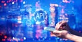 API - application programming interface concept with person using a smartphone at night Royalty Free Stock Photo