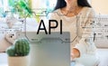 API concept with woman using her laptop Royalty Free Stock Photo