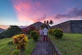 Api volcano at sunset, couple looking at view from Banda Naira fort, Maluku Moluccas Indonesia, Top travel tourist destination,