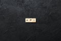 API word written on wood block. application program interface text on table, concept