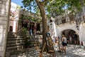 Apiranthos, Naxos / Greece - July 13, 2019: Toutists visiting the narrow streets and shops of Apiranthos Royalty Free Stock Photo