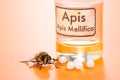 Apis Mellifica homeopathic pills, poison and bee Royalty Free Stock Photo