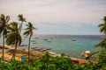 Apo island, Philippines, view on island beach line. Palm trees, sea and boats. Royalty Free Stock Photo