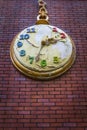 Apocalypse concept - Decorative pocket clock on a red bricks wall with peeled paint