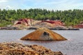 Apocalyptic landscape like a planet Mars surface. Fantastic view of crimson red lake. Solidified red-brown black Earth surface. Royalty Free Stock Photo