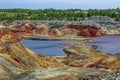 Apocalyptic landscape like a planet Mars surface. Fantastic view of crimson red lake. Solidified red-brown black Earth surface. Royalty Free Stock Photo