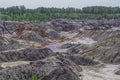 Apocalyptic landscape like a planet Mars surface. Fantastic view of crimson red lake. Solidified red-brown black Earth surface. Royalty Free Stock Photo